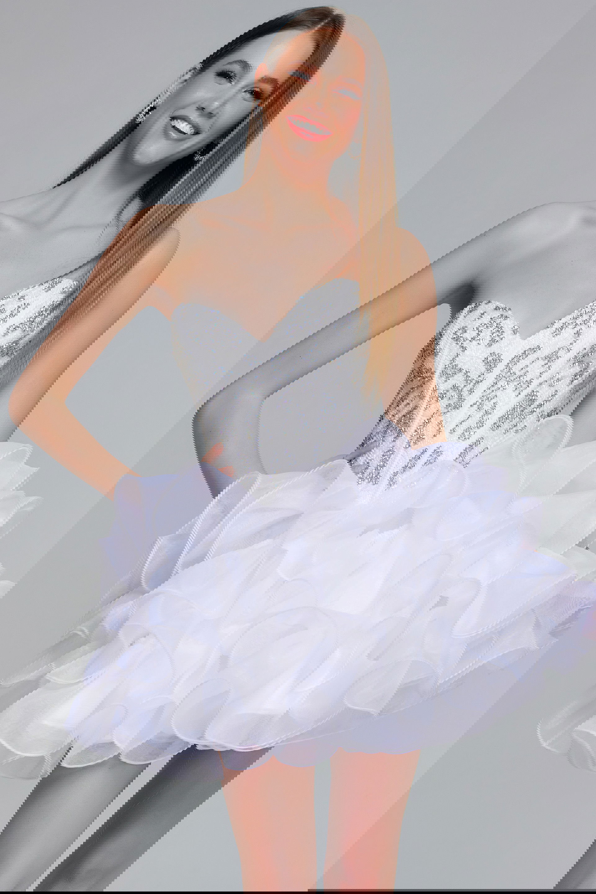 k44215-kids.jpg Model wearing k44215 dress with a sequin-embellished bodice and ruffled organza skirt.