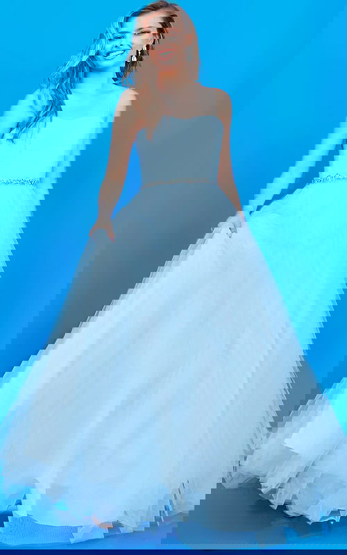 Model wearing Jovani k66712 blue ball gown with sweetheart neckline and embellished waistband.