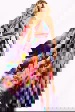 Sleeveless chiffon halter gown with pleated skirt and waist detail