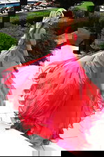 Model wearing two-tone chiffon gown with ruched bodice and flowing skirt