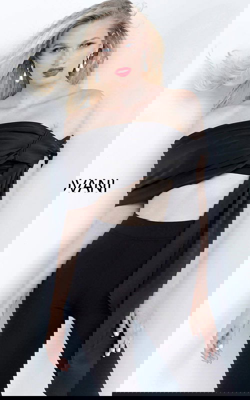 Model wearing Jovani 68693 black off-the-shoulder top with elegant draping.